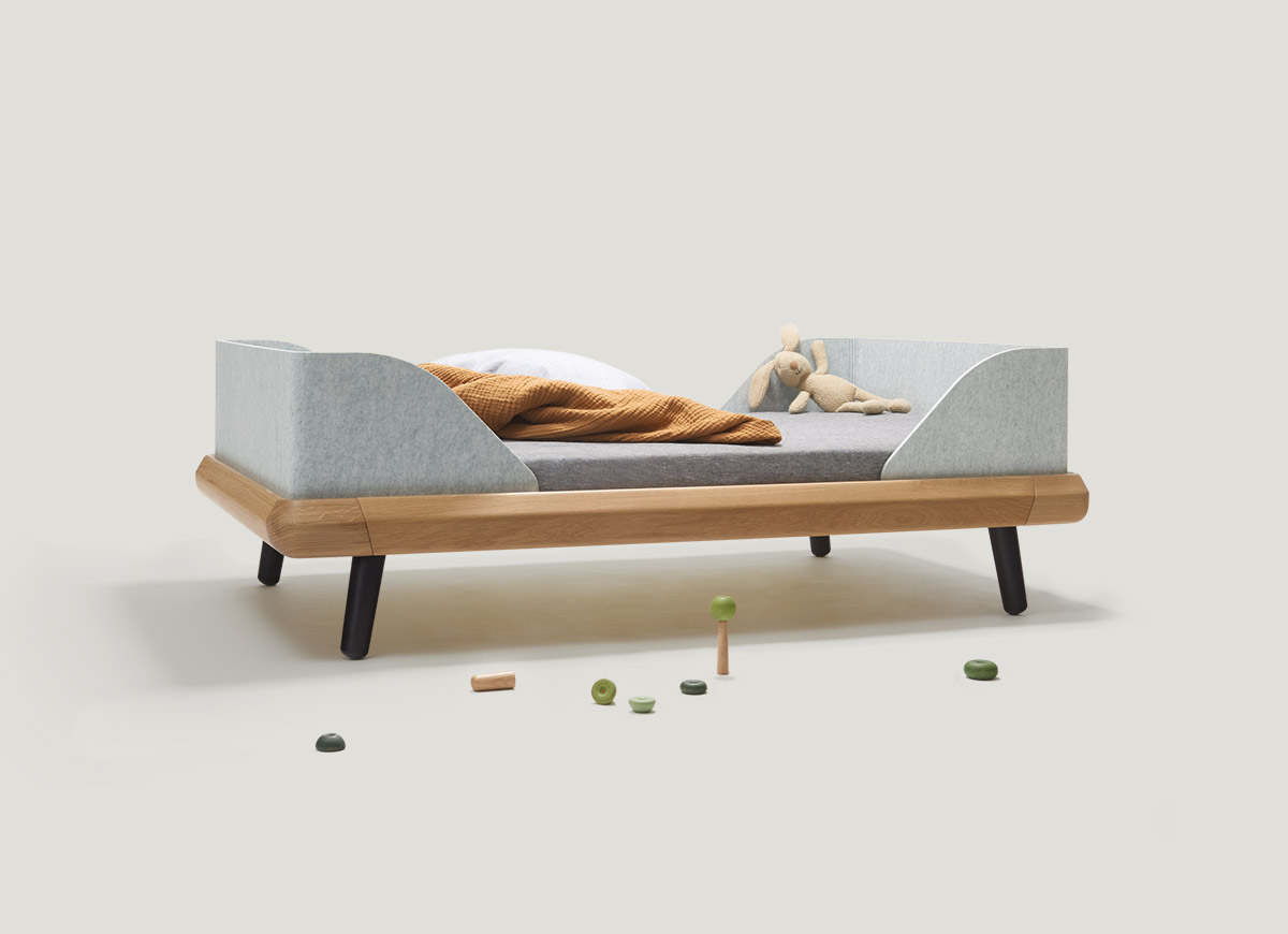 The VII frame junior bed made of solid oak grows with your child